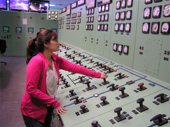 Woman at work on control panel