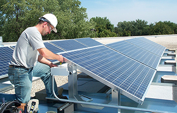 IBEW member installing solar panels